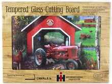 Load image into Gallery viewer, IH Farmall H Tractor with Covered Bridge Glass Cutting Board, 15.5in x 11.75in